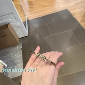 NWT Coach Bow Hinged Bangle Gold Color Plated brass CEM46 with dust bag